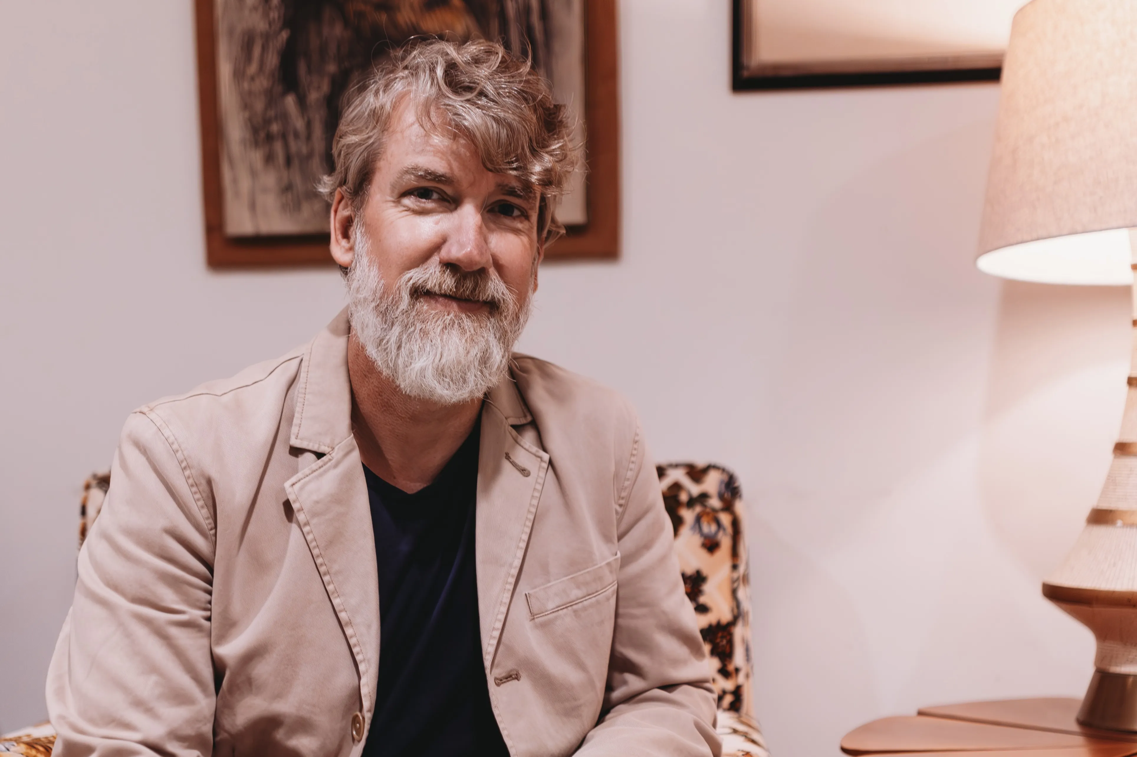 Todd Burdge seated by lamp